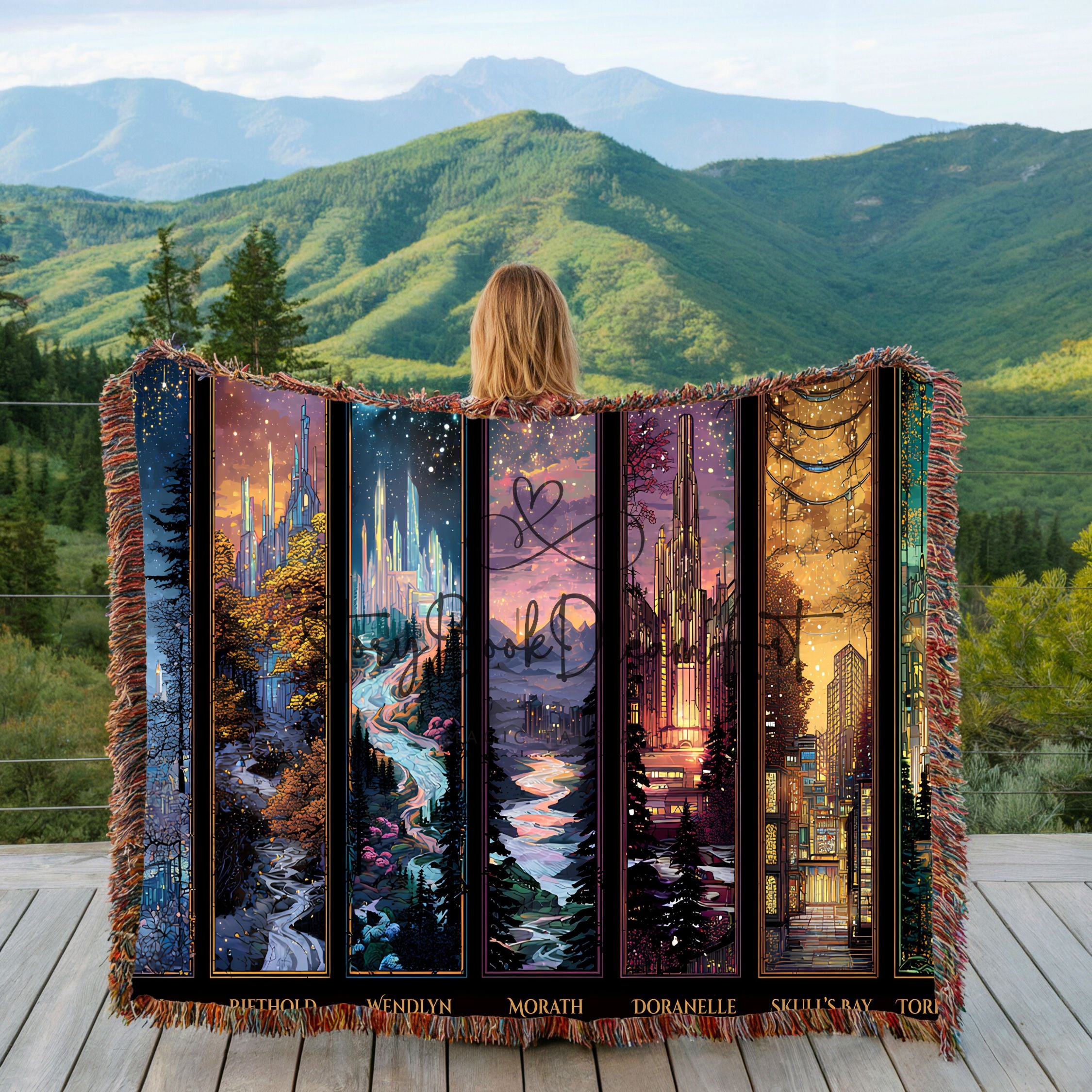 fantasy city realm woven blanket displayed outdoors with mountains, scenic fantasy panel woven throw with fringe edges, bookish fantasy cityscape blanket draped over railing