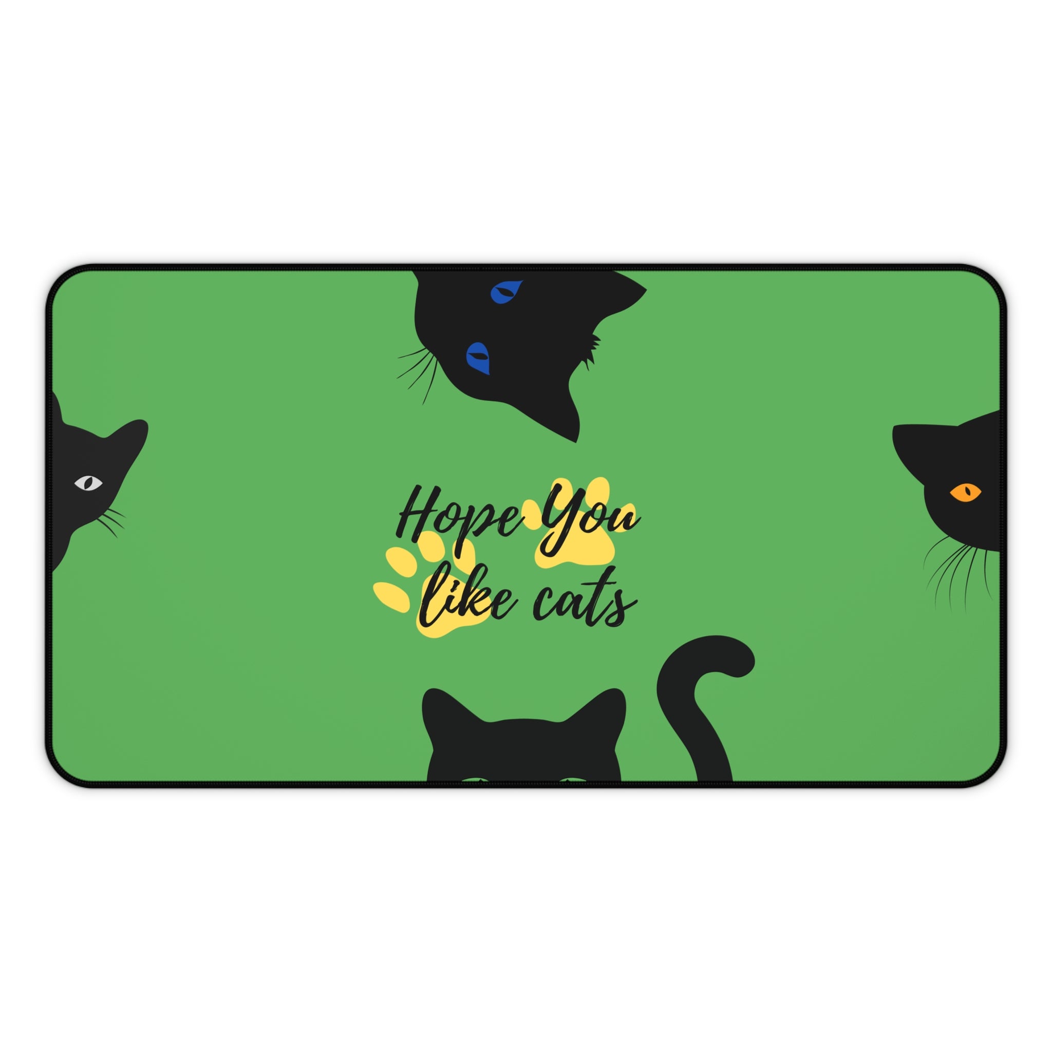 extended green desk mat with playful black cat illustrations