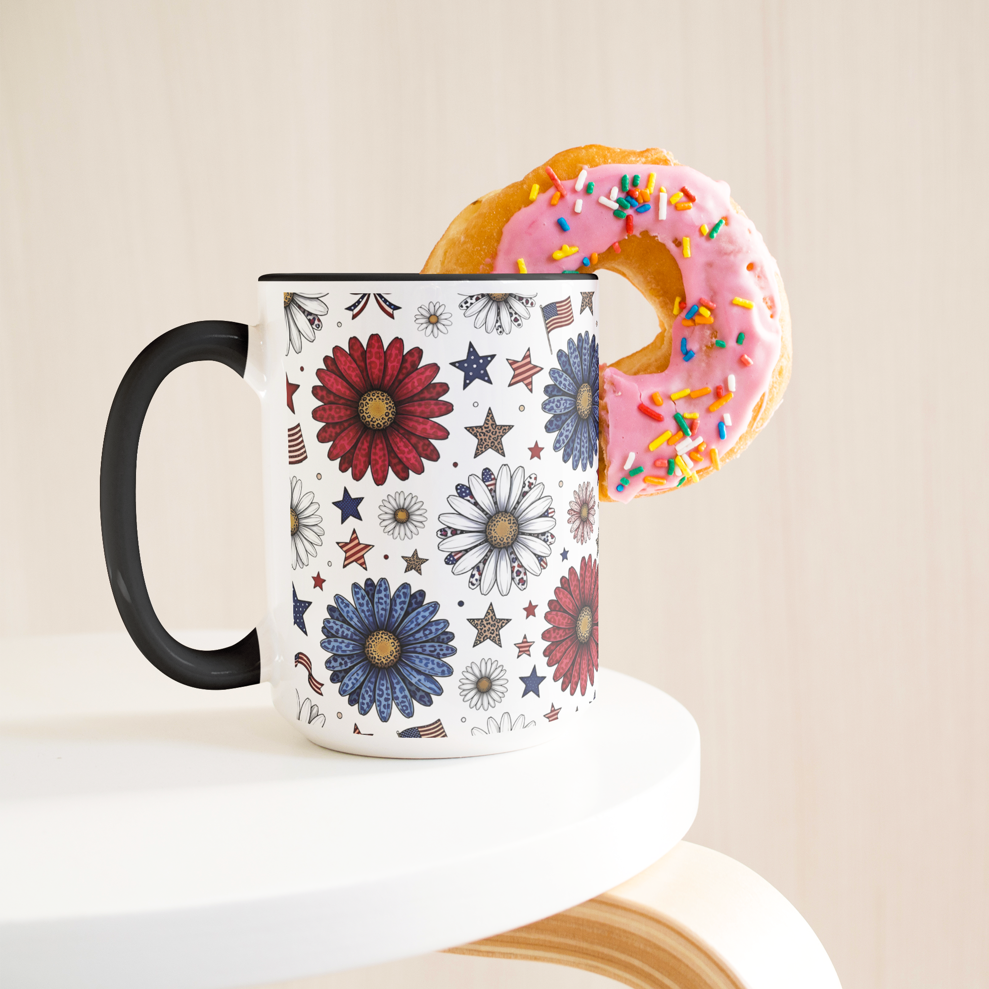 Daisy_and_flags_15oz_Black_Accent_Mug_Lifestyle_Donut_LH_Mockup.png_15743850
