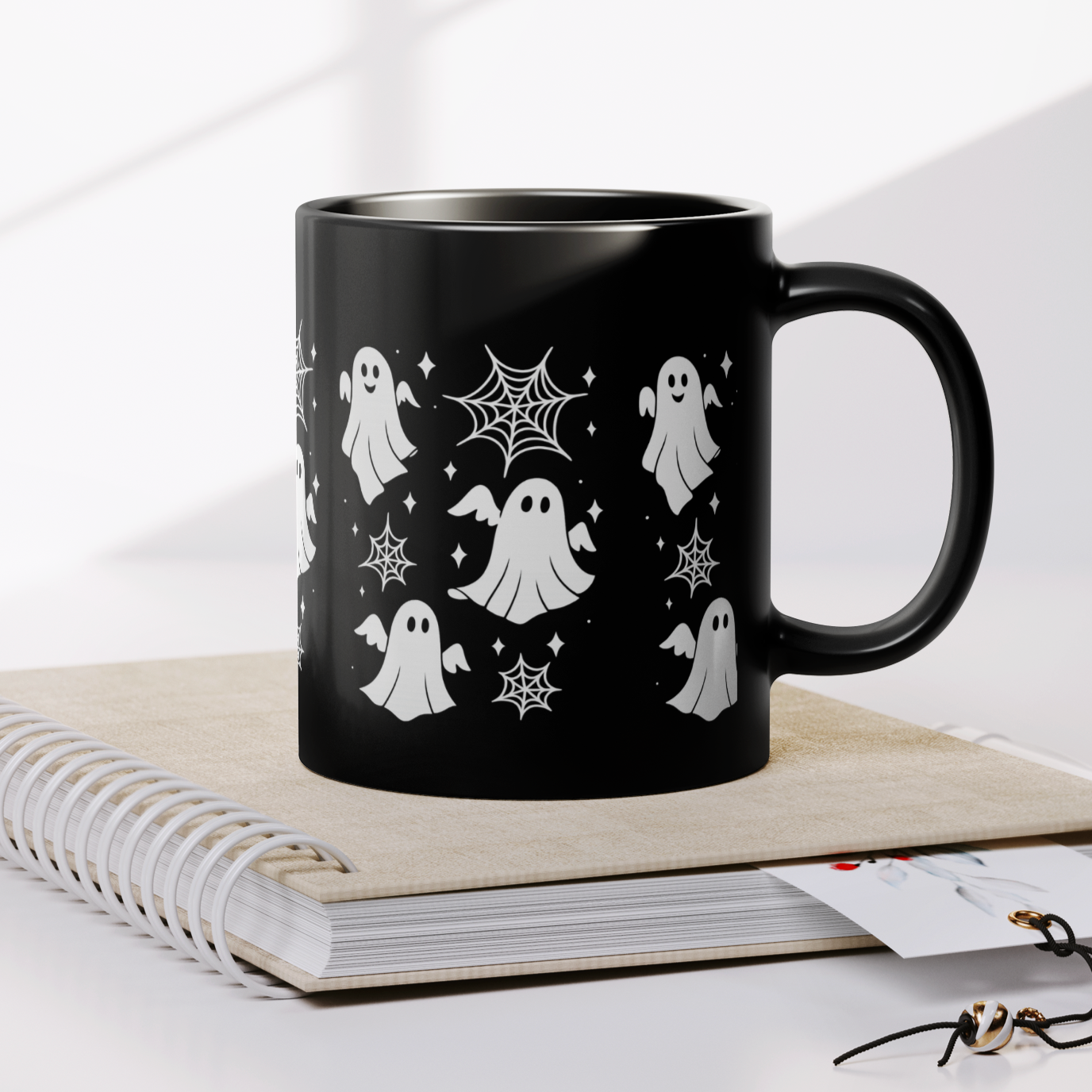 Spooky ghost mug for fall pumpkin spice lattes, dishwasher safe black ceramic drinkware.