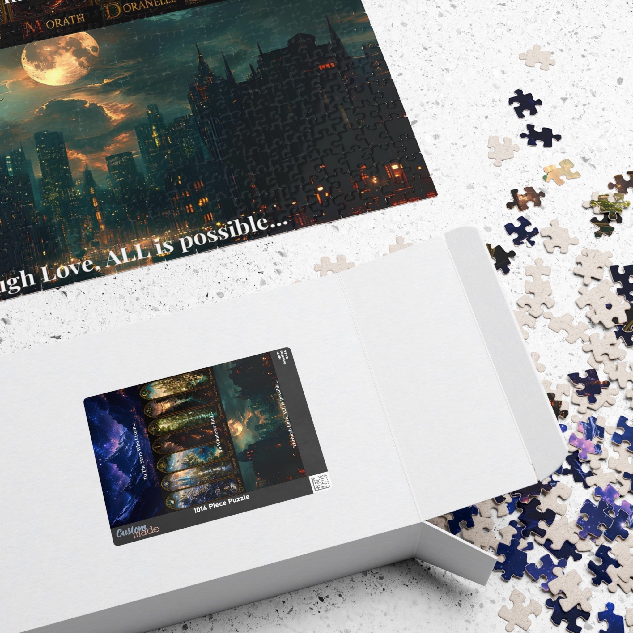A white jigsaw puzzle box shown open on a light speckled surface, with a partially assembled dark fantasy cityscape puzzle placed above it and loose puzzle pieces scattered around. The box label reads 'Fantasy Puzzle Co' and '2024 Puzzle Puzzle.