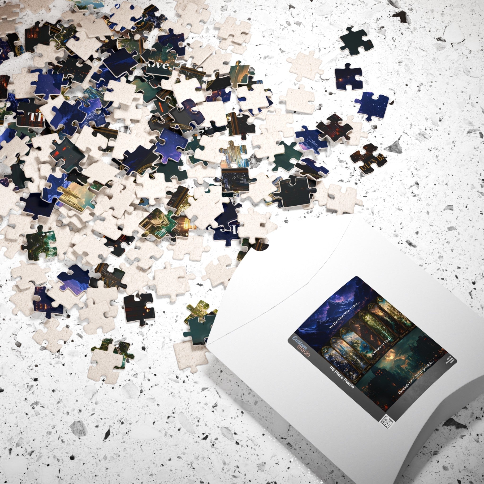 A white jigsaw puzzle box lies on a white speckled surface with many loose puzzle pieces scattered across it. The visible puzzle piece artwork shows a dark fantasy landscape with blue, green, and black tones.