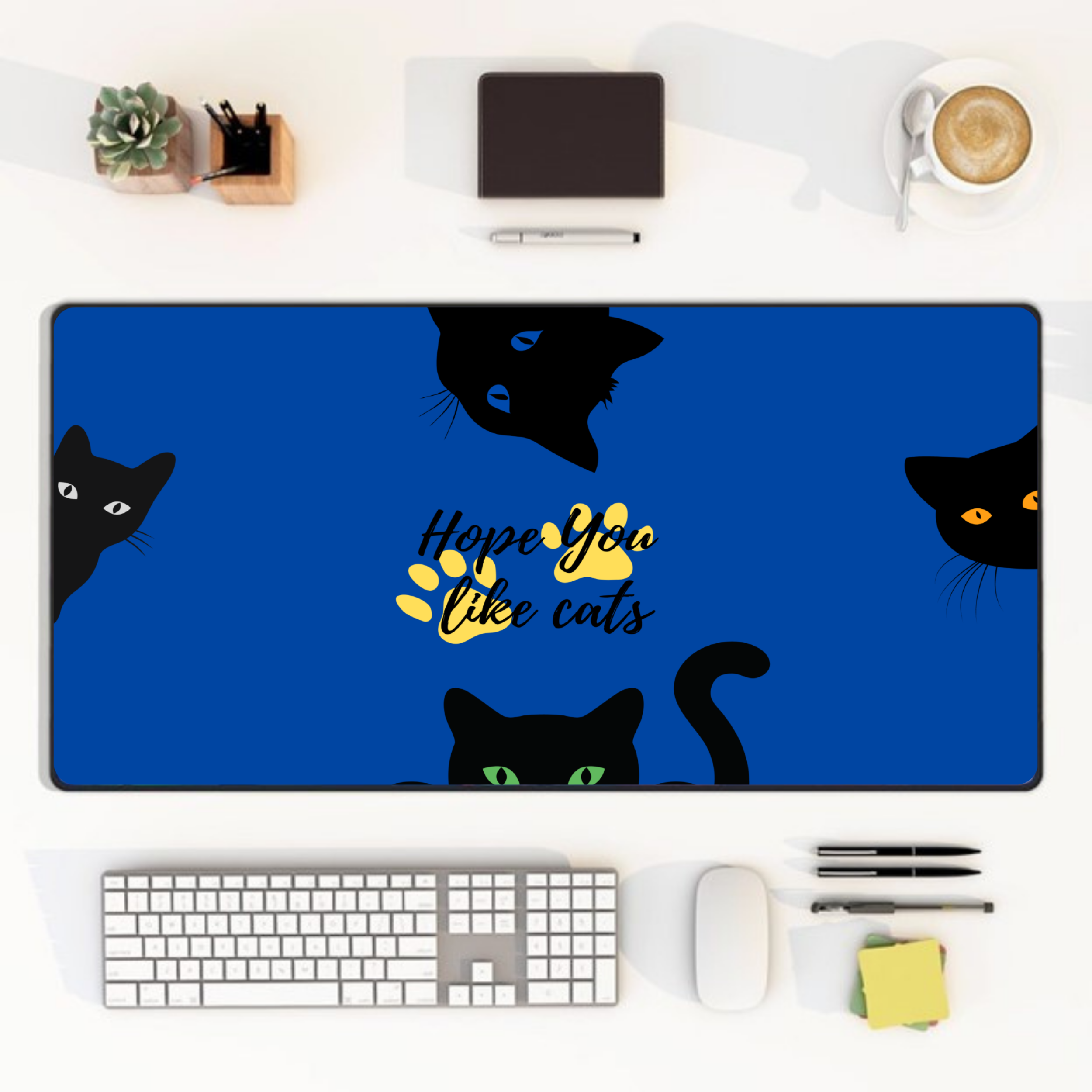 blue cat desk mat with black cat faces and paw print design