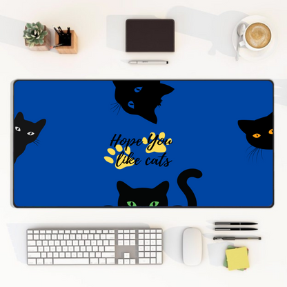 blue cat desk mat with black cat faces and paw print design
