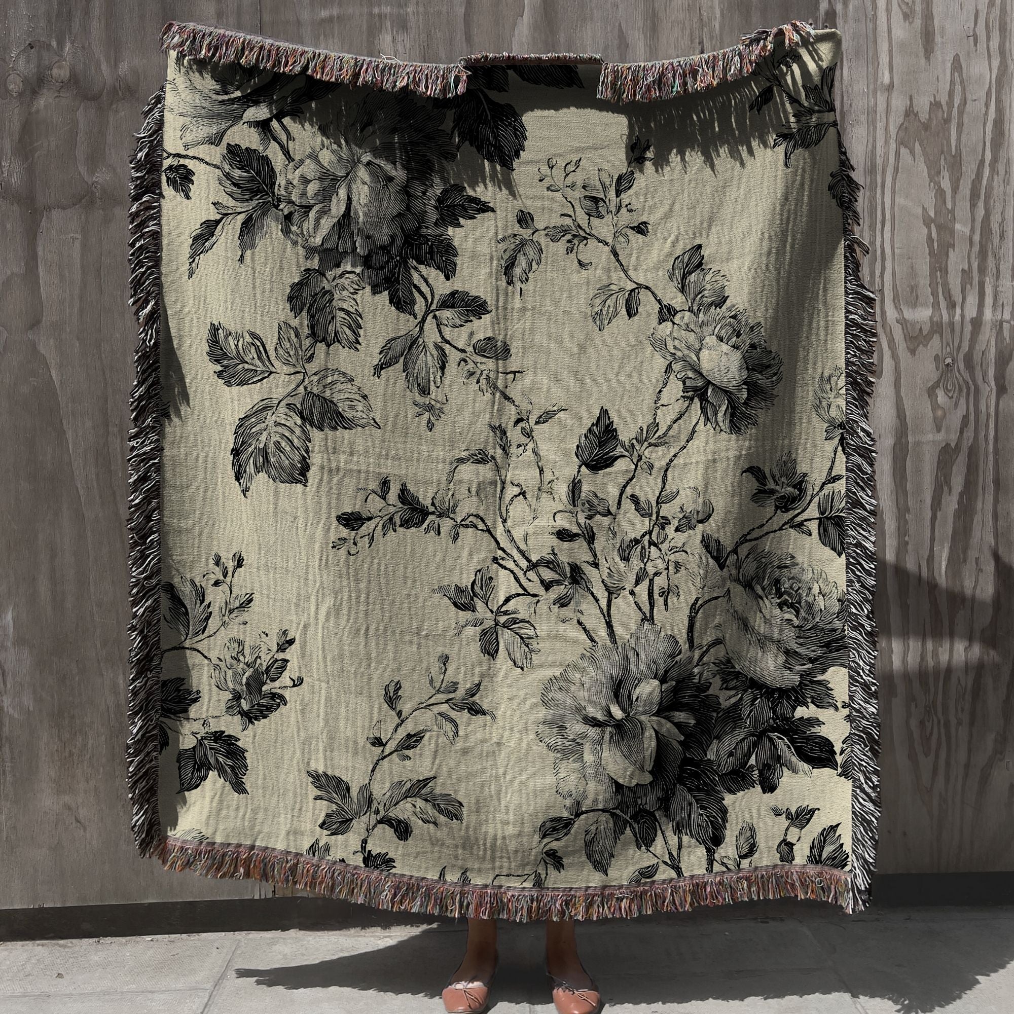 vintage toile floral woven throw blanket with fringe in neutral beige and black, cottagecore toile woven cotton throw blanket draped for cozy home decor
