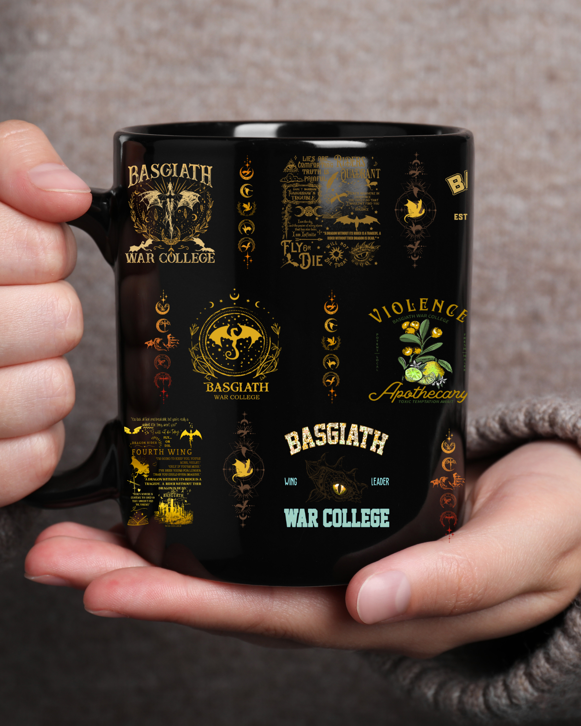 black coffee mug with gold Basgiath War College design held by reader, romantasy mug for book lovers, fantasy coffee cup for cozy mornings