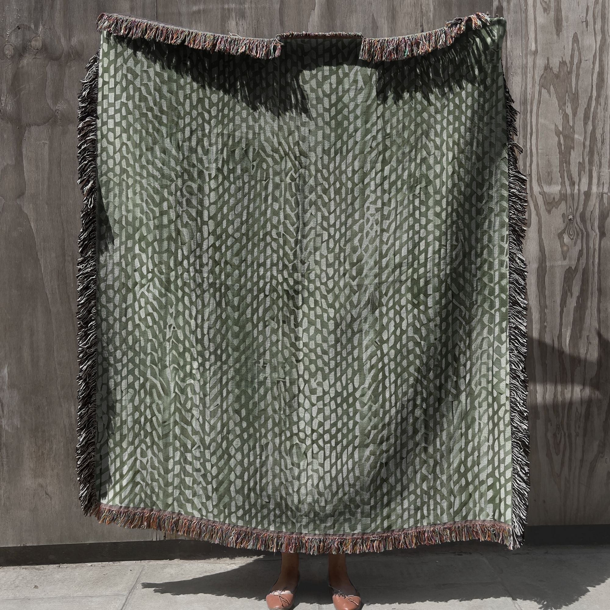 woven sage green throw blanket with fringe on neutral background, sage green woven cotton throw blanket for cozy living room decor, textured sage green sofa throw blanket with woven pattern