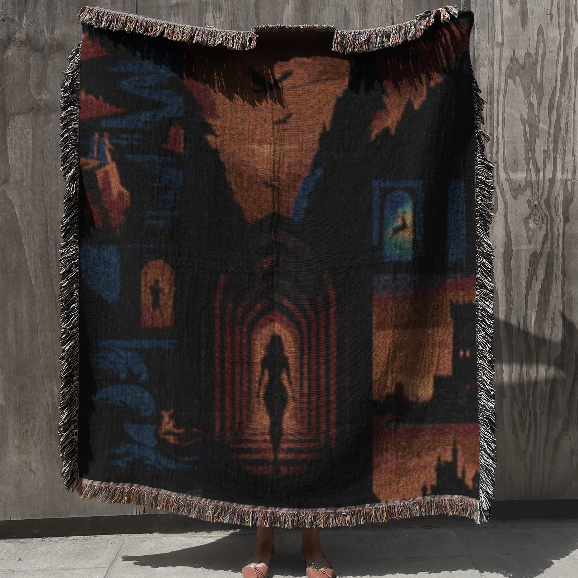 Fantasy woven cotton throw blanket draped over a cozy reading chair with stacked books