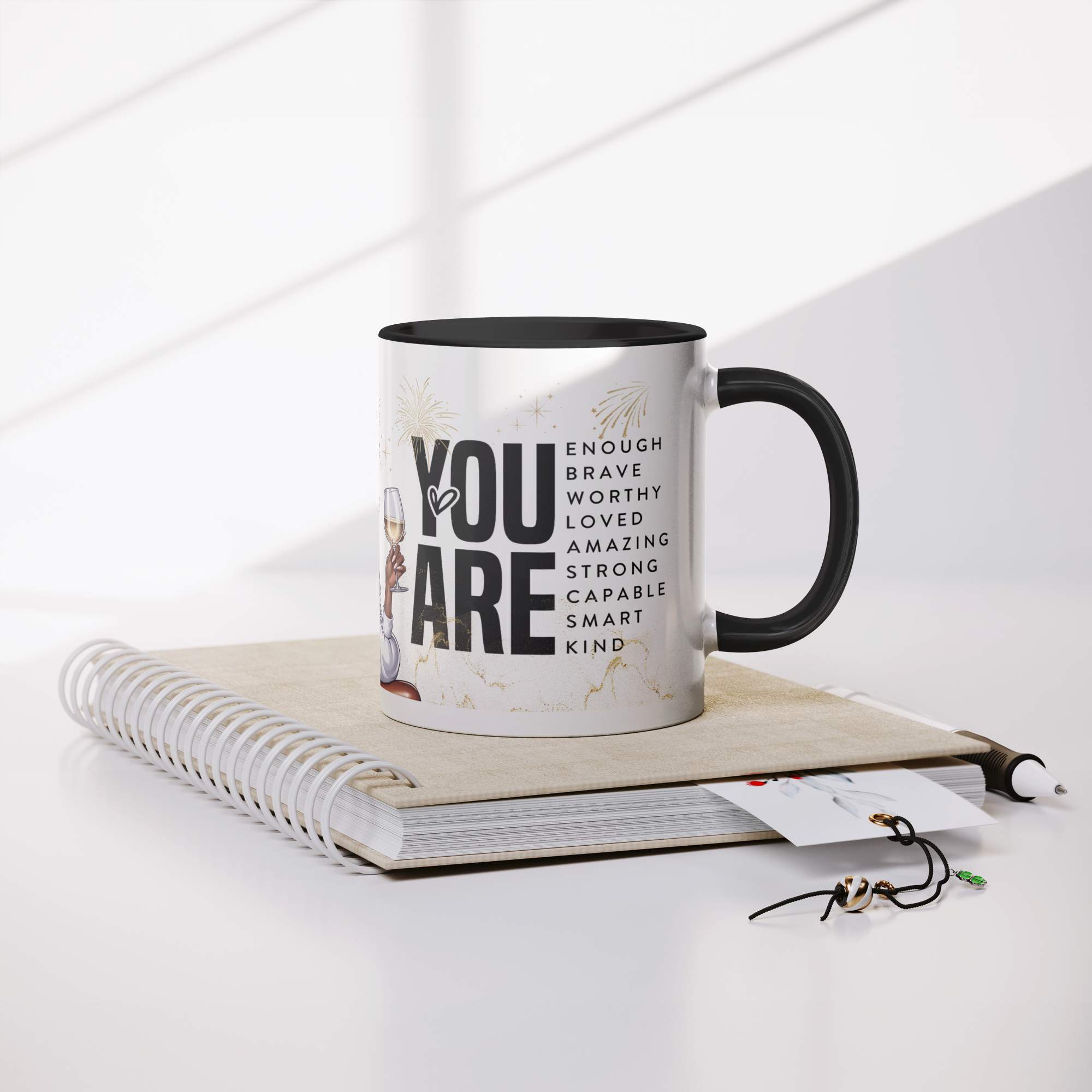 Stronger_than_the_storm_11oz_mug_Mug_Lifestyle_Notebook_Mockup.png