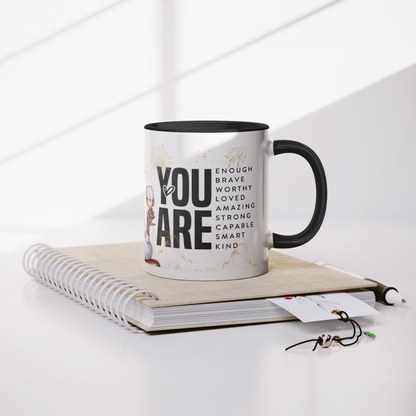 Stronger_than_the_storm_11oz_mug_Mug_Lifestyle_Notebook_Mockup.png
