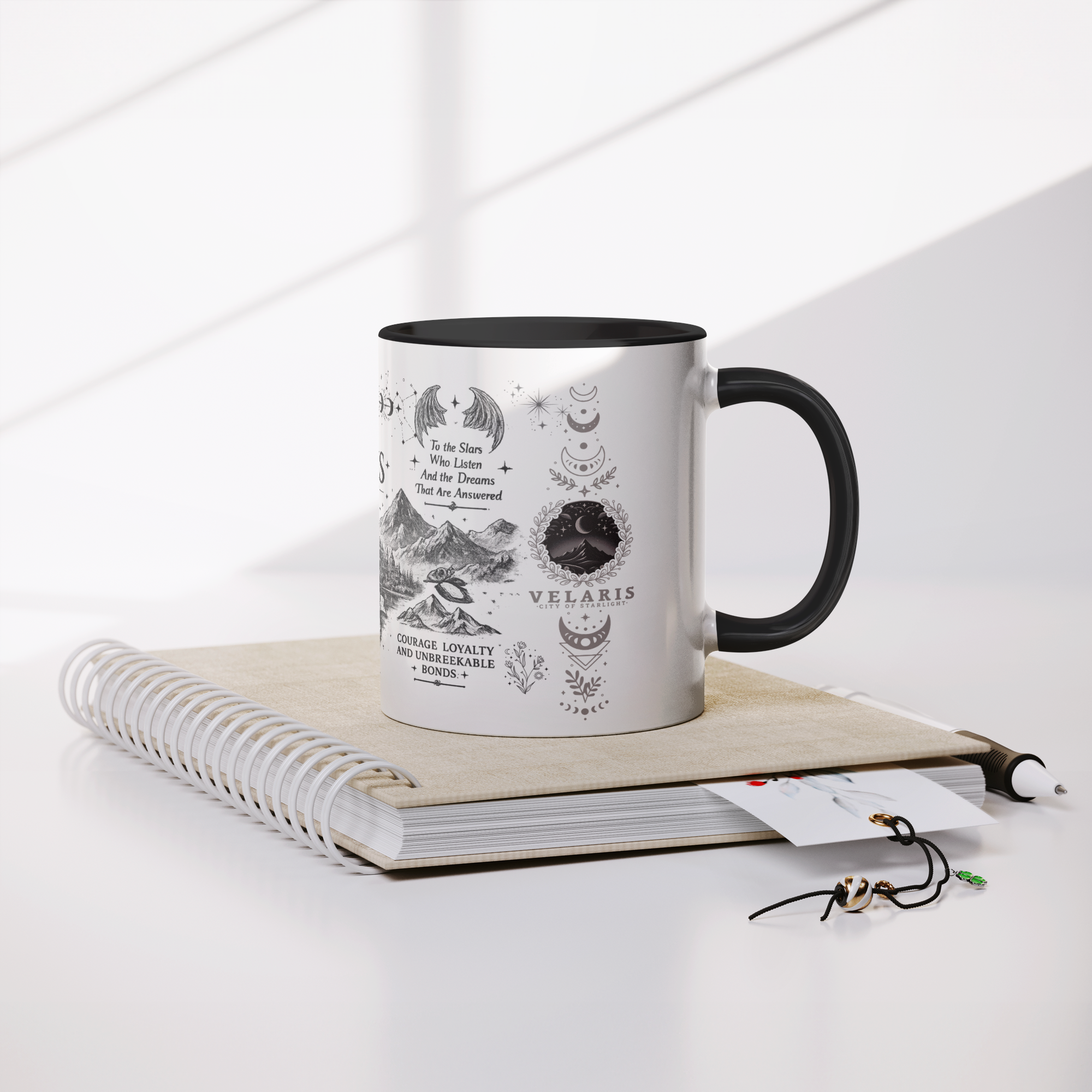 Velaris_11oz_Black_Accent_Mug_Mug_Lifestyle_Notebook_Mockup.png_15659430