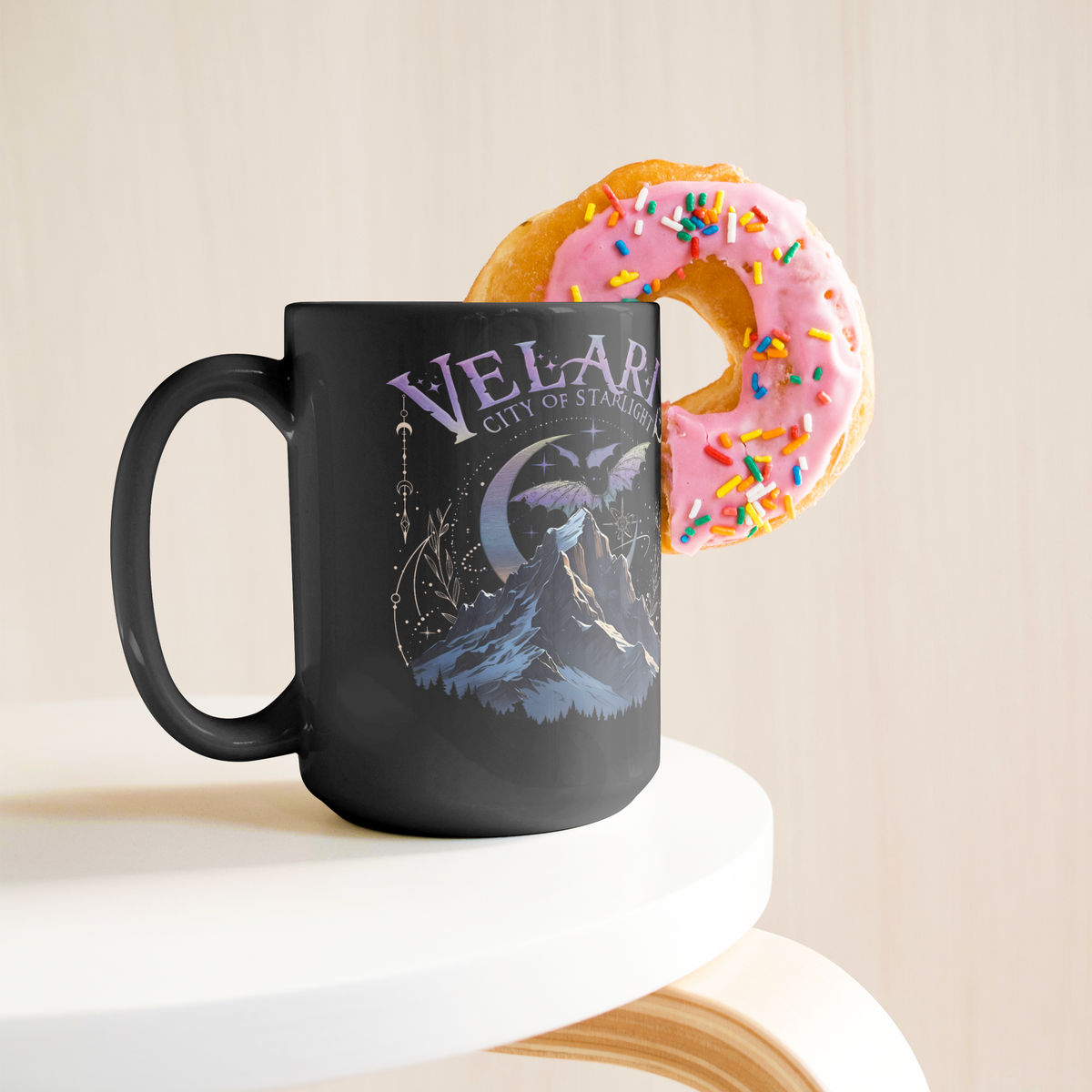 Velaris_City_of_Starlight_15oz_blk_mug_Lifestyle_Donut_LH_Mockup.png_16129914