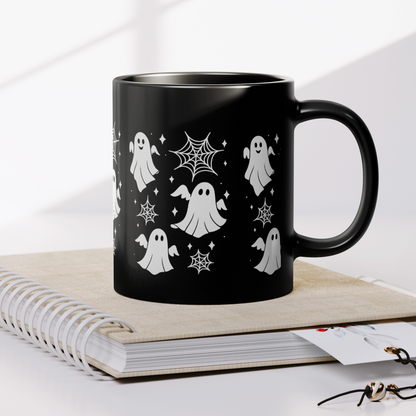 Spooky ghost mug for fall pumpkin spice lattes, dishwasher safe black ceramic drinkware.