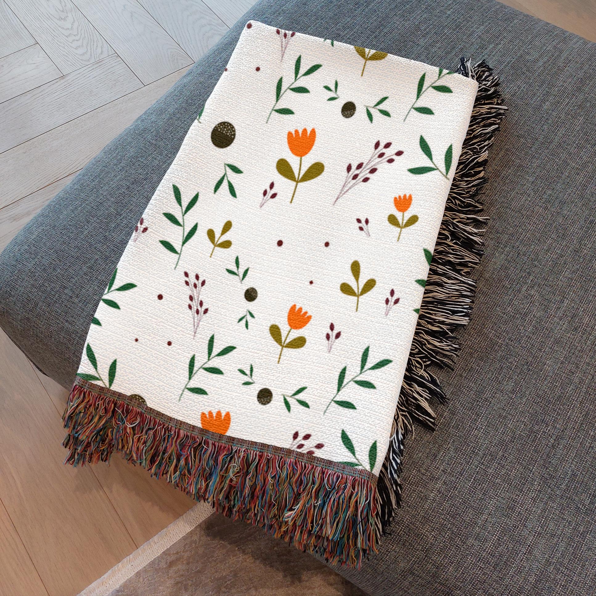 Close-up of artisan fringe edges on woven floral throw
