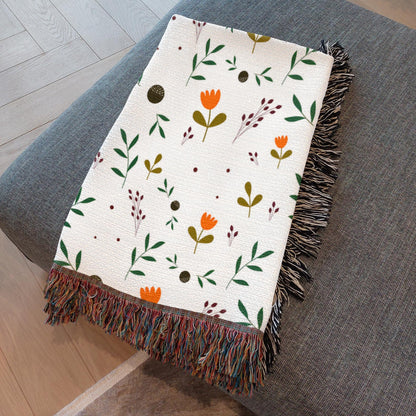 Close-up of artisan fringe edges on woven floral throw